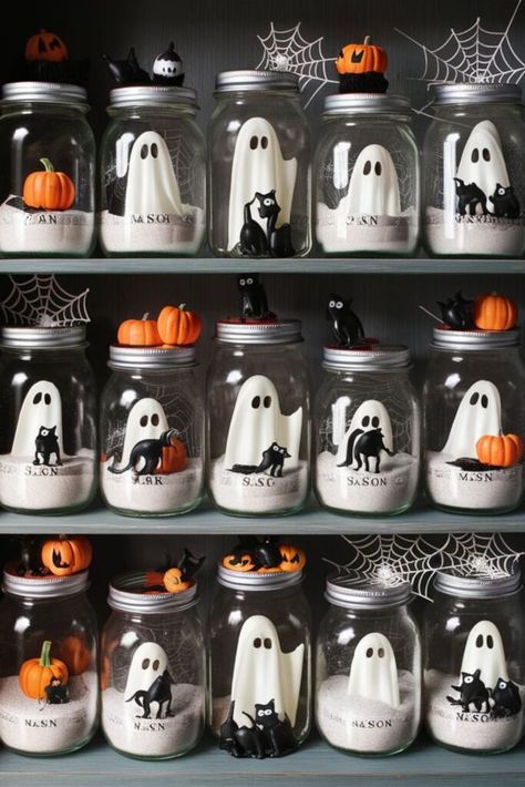 25 DIY Ghost Decoration [Within Budget] – craftydiyers.com Ghost Table Centerpiece, Halloween Jar Crafts, Diy Ghost In A Jar, Diy Adopt A Ghost, Pet Ghost In A Jar Diy, Ghost Crafts For Adults, Diy Ghost Decor, Diy Halloween Crafts For Adults, Ghost In A Jar Diy