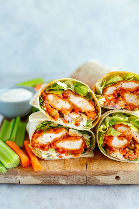 This is truly the BEST Buffalo Chicken Wrap you'll ever eat, with the crispiest baked chicken tenders coated in sauce. It's my fave lunch! Healthy Buffalo Chicken Wraps For Lunch, Best Buffalo Chicken Wraps, Crunchy Chicken Wraps, Grilled Chicken Wrap Recipes Healthy, Buffalo Wraps Chicken, Crispy Chicken Ranch Wraps, Chicken Wrap Sandwiches, Chicken Tender Wraps Recipes, Buffalo Chicken Wraps Air Fryer