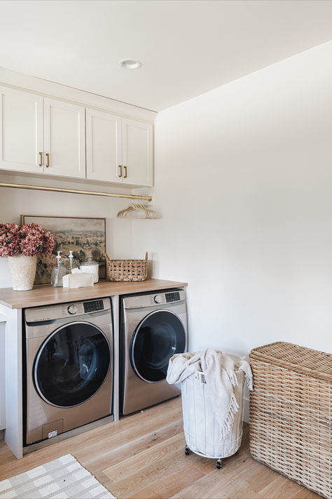 Spring laundry room details! Light and airy space with aesthetic organization and gold details   Home finds, spring refresh, laundry room details, aesthetic home, neutral home, laundry basket, velvet hanger, gold details, glass dispenser, neutral area rug, Pottery Barn style, Target, found it on Amazon, faux florals, tissue box, basket faves, organization details Neutral Laundry Room, Detail Aesthetic, Found It On Amazon, Aesthetic Organization, Pottery Barn Style, Neutral Area Rug, Home Neutral, Mudroom Laundry, Vintage Laundry Room