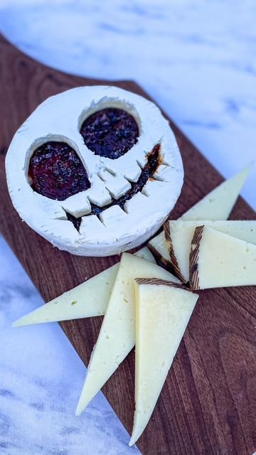 MakeFoodLovely CT Charcuterie on Instagram: "halloween series: don’t brie scared ⁣ ⁣ over the next three weeks, I will be posting classic spookiness, having taken cheese form ⁣ ⁣ part one: the pumpkin king himself, ⁣ jack skellington ⁣ ⁣ the nightmare before christmas had escaped me in childhood, but my son found it on @disneyplus and we have been watching it on repeat for weeks. quick tip: it helps to work with very cold brie when carving out the face, but best to serve after having sat out f Brie Skull Charcuterie, Halloween Bree Cheese, Skull Brie Cheese, Spooky Brie Cheese, Jack Skellington Party Food, Skeleton Brie Cheese, Halloween Brie Cheese Ideas, Spooky Baked Brie, Nightmare Before Christmas Food Recipes