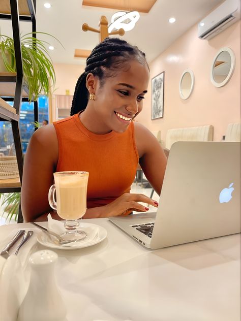 ‘Black lady sitted at a restaurant with a cup of coffee, laughing while using her laptop’ Networking Aesthetic Black Women, Remote Work Aesthetic Black Woman, Black Woman Podcast Aesthetic, Girl Working On Laptop Aesthetic, Girls Working On Laptop, Black Writers, Work Pictures, Beauty Youtubers, Coffee Shop Aesthetic