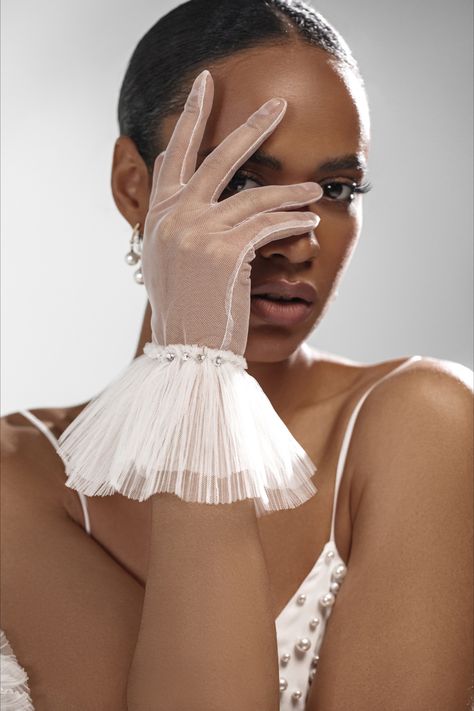 Complete your look with our Short White Sheer Wedding Gloves, adorned with a charming ribbon. These gloves elevate your style, lending a touch of sophistication to your formal event. Experience elegance and comfort with these exquisite ribbon wedding gloves. Wedding Dress With Gloves, Sheer Gloves, Short White Dress Wedding, Bridal Wardrobe, Dress With Gloves, Vintage Hollywood Glamour, Bridal Elegance, Wedding Gloves, Bridal Gloves