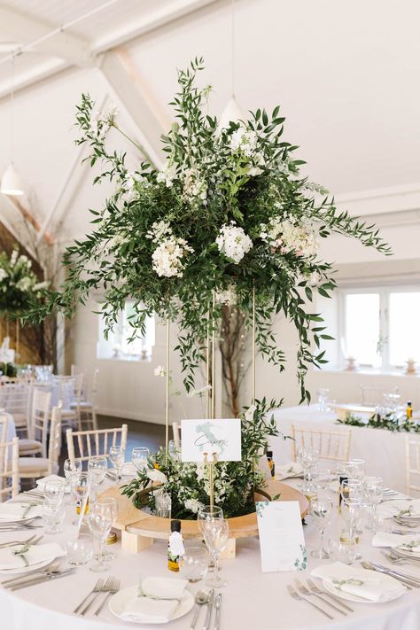 Green Centrepiece Wedding, Green And White Tall Centerpieces, White Flower Centrepiece Wedding, Greenery And White Flowers Centerpieces, Green And White Flower Arrangements Tall Centerpiece, Tall Table Centerpieces Wedding, Green Wedding Flowers Centerpiece, Tall Table Decorations Wedding, Wedding Reception Floral Centerpieces