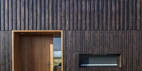 Howe Farm | IPT Architects | Archello Timber Planks, Wood Facade, House Cladding, Rural House, Wooden Buildings, Wood Cladding, Casa Exterior, Door Open, Timber Cladding