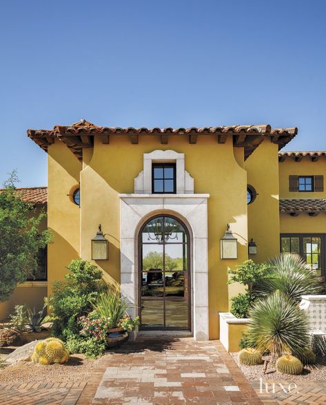 Mediterranean Yellow Front Exterior | Luxe Interiors + Design Red Dining Rooms, Yellow House Exterior, Stucco Colors, Red Dining Room, Stucco Homes, Tuscan House, Yellow House, Spanish Style Homes, Shutters Exterior