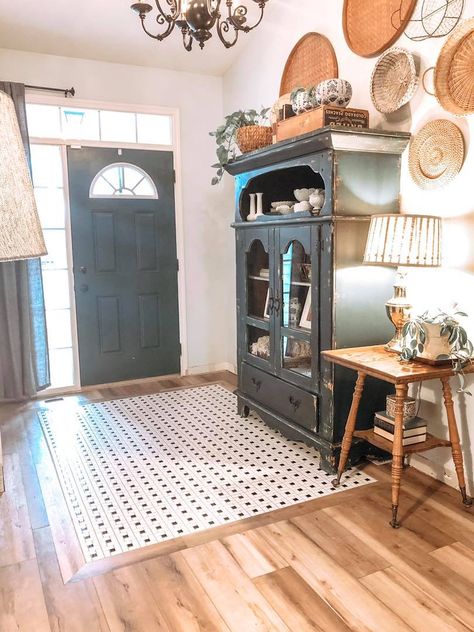 I am so glad we decided to add a tile rug when we were redoing our floors with luxury vinyl tile! It adds the perfect touch to the entryway! Rug In Entryway, Tile Inlay, Entryway Tile, Entryway Flooring, Luxury Vinyl Tile Flooring, Vinyl Tile Flooring, Tile Rug, Flooring Projects, Black And White Tiles