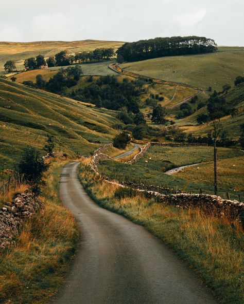 North Yorkshire, England North Yorkshire is a historic county in northern England known for its picturesque countryside and charming villages. It is home to the stunning Yorkshire Dales and North York Moors National Parks. # London In Winter, Day Trips From London, In The Middle Of Nowhere, Middle Of Nowhere, Winding Road, Yorkshire Dales, Country Road, Nature Aesthetic, Pretty Places