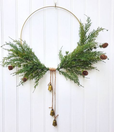 Gold Hoop Christmas Wreaths, Natural Christmas Wreaths Modern, Gold Hoop Wreath Christmas, Evergreen Citrus Boho Christmas, Gold Hoop Christmas Wreath, Hoop Wreath Christmas, Boho Christmas Wreath, Minimalist Christmas Wreath, Christmas Wreath With Bells