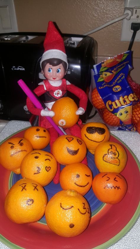 Elf on the Shelf draws emoji faces on the small oranges. Elf On The Shelf With Oranges, Elf Oranges, Elf With Oranges, Elf On The Shelf Oranges, Elf On The Shelf Drawing On Face, Bowl Of Oranges, Pumpkin Elf, Elf Shenanigans, Elf Drawings