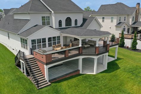 Open porches are the standard porch that many people envision when they want to cover their deck or patio. Tiered Decks And Patios, Deck Off Back Of House Second Floor, Big Deck Ideas, Two Story Deck Ideas, Deck With Patio Underneath, 2nd Floor Deck Ideas, Backyard Platform, Deck To Patio Transition, Covered Deck Ideas On A Budget