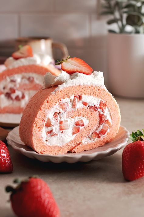 This strawberry swiss roll cake is made with a soft and fluffy chiffon cake wrapped around airy whipped cream and fresh strawberries. It's a pretty pink cake that tastes like you're eating a cloud! #swissroll #rollcake #strawberrycake #chiffoncake | teakandthyme.com Pretty Pink Cake, Strawberry Swiss Roll, Easter Strawberry, Strawberry Roll, Swiss Roll Cakes, Strawberry Roll Cake, Swiss Rolls, Easter Cupcake, Swiss Roll Cake