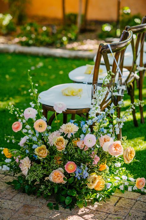 Peach Blue Yellow Bouquet, Spring Wedding Linens, Ground Aisle Arrangements, Colorful Wedding Aisle Flowers, Pink Orange Yellow Blue Wedding, Small Wedding Aisle, Pastel Flower Wedding Cake, Pink Orange Blue Wedding Flowers, Delphinium Wedding Flowers