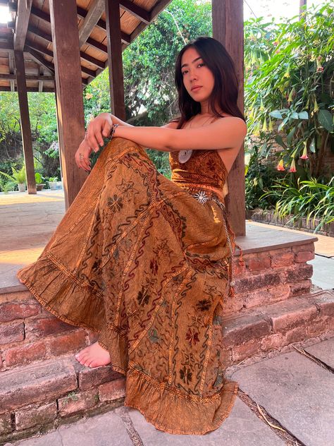 Introducing our Pari Vintage Vibe Brown Embroidery Maxi Skirt, perfect for embracing those boho and hippie vibes! This stunning skirt features pleated borders that add a touch of elegance, while the maxi length offers a chic and comfortable fit.Crafted with fairly-core fashion inspiration, this skirt is ideal for creating enchanting cottage-core looks. Whether you're strolling along sandy shores or exploring hidden getaways, this skirt will ensure you're dressed to impress. Its flowing silhouett Earthy Maxi Skirt, Cottage Clothes Aesthetic, Brown Boho Outfit, Fairy Hippie Outfits, Maxi Skirt And Tshirt, Boho Maxi Skirt Outfit, Black Hippie Aesthetic, Brown Dress Aesthetic, Boho Moodboard