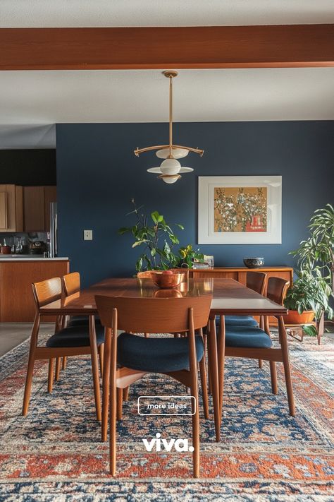 ♥ Are you ready to upgrade your dining room with a touch of Mid Century modern elegance? Feast your eyes on this stunning dining room featuring a stylish Mid Century modern dining room table and colorful wall art. Get inspired with Mid Century modern dining room decor ideas now! 🍽️🎨 #mcmdinningroom #midcenturydecor #diningroominspiration Dining Room Decor 70s, Boho Mid Century Dining Room, Moody Mid Century Dining Room, Dining Mid Century Modern, Mid Century Meets Traditional, Jewel Toned Dining Room, Small Mcm Dining Room, Deep Blue Dining Room, Peacock Blue Dining Room