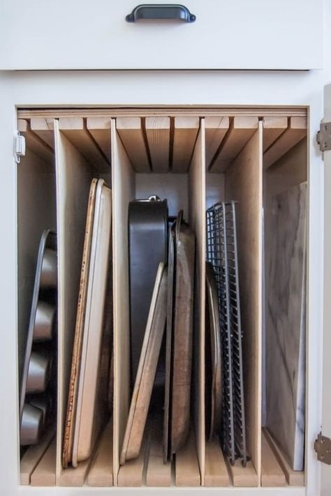 How to store baking racks/tall items - note grooved top 10 Tiny Organizing Tasks You Can Do in 10 Minutes or Less — Organize Thyself | The Kitchn Appliance Storage, Organiser Cucina, Dreamy Kitchens, Hidden Cabinet, Desain Pantry, Budget Remodel, Kabinet Dapur, Kitchen Organizers, Practical Kitchen