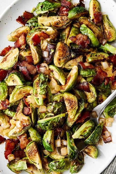 This balsamic Brussels sprouts with bacon is a fall and winter side dish that never lasts long. It's always popular for a Thanksgiving side dish and much loved for Christmas dinner or Easter dinner! Roasted Brussels sprouts are tossed with crispy bacon, sautéed onion, and my homemade balsamic glaze for a sweet, tangy finish that everyone will love. SAVE this Downshiftology recipe for your next vegetable side dish inspiration! Veggie Side Dishes For Thanksgiving, Downshiftology Recipes, Balsamic Brussels Sprouts, Bacon Brussels Sprouts, Winter Side Dishes, Side Dish For Thanksgiving, Bacon Fried Cabbage, Brussels Sprouts With Bacon, Veggie Side Dish