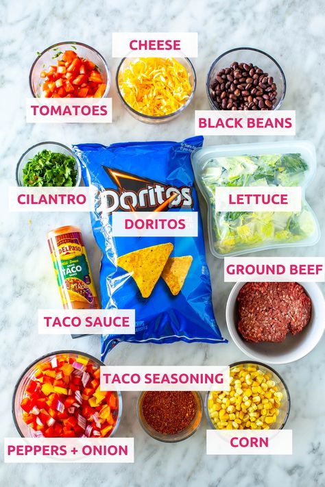 This Dorito Taco Salad is a fun 20-minute dinner idea made with crunchy Cool Ranch Doritos, fresh veggies, cheese and taco sauce. Dorito Taco Salad, Cool Ranch Doritos, Dorito Taco, Taco Salad Doritos, Doritos Taco, Taco Salad Recipe, Sauteed Peppers And Onions, 20 Minute Dinners, Beef Sauce