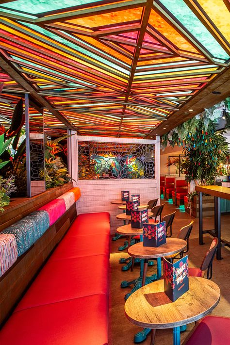 Beautiful tropical restaurant and bar design. Interior design for rainforest inspired Indian bar restaurant. Colourful, funky, bold, eye-catching. Instagrammable interior design. Trees, planting and flowers restaurant. South American Restaurant Design, American Design Interior, Latin American Restaurant Design, Traditional Mexican Restaurant Design, Tropical Restaurant Design, Instagrammable Interior, Ministry Aesthetic, Trendy Mexican Restaurant, Indian Restaurant Interior Design