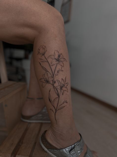 #tattoo #flowertattoo #lily #fineline #legtattoo #tattoosforwomen #tattoodesign Lily Fineline Tattoo, Fineline Leg Tattoo, Lily Leg Tattoo, Lily Flower Tattoo, Lillies Tattoo, Tattoo On Leg, Lily Flower Tattoos, Fineline Tattoo, Lily Tattoo