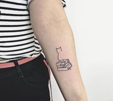 Book Tattoo With Cat, Cat On A Book Tattoo, Cat Book Tea Tattoo, Audiobook Tattoo Ideas, Cat Sitting On Books Tattoo, Cat Book Tattoo Ideas, Reading Lover Tattoo, Cats Books And Coffee Tattoo, Cat On Stack Of Books Tattoo