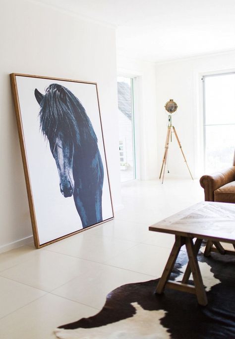 Eclectic living space with a large photograph propped up on the floor, and a leather sofa Leaning Against Wall, Large Scale Wall Art, Picture Arrangements, Equestrian Home, Art Styling, Art At Home, Large Artwork, Photography Wall, Inspiration Wall