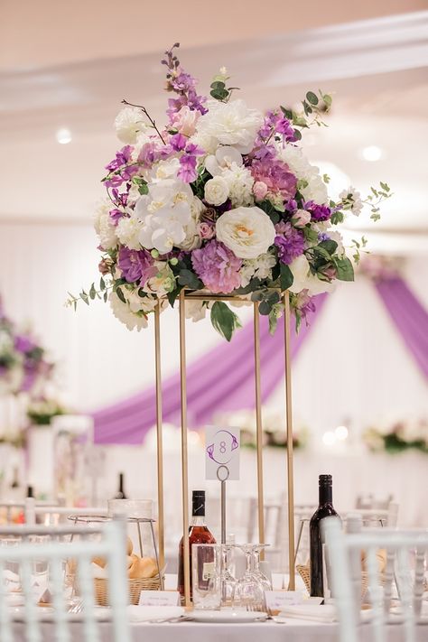 Gorgeous purple and white mixed floral centerpiece for a romantic purple wedding. Pink Purple White Wedding Decor, Purple And White Flower Centerpieces, Purple Decorations Wedding, Lavender Quinceanera Decorations Centerpieces, Purple And White Wedding Decorations, Purple Quinceanera Centerpieces, Quince Centerpieces Flowers, Purple Quince Centerpieces, White And Purple Wedding Theme