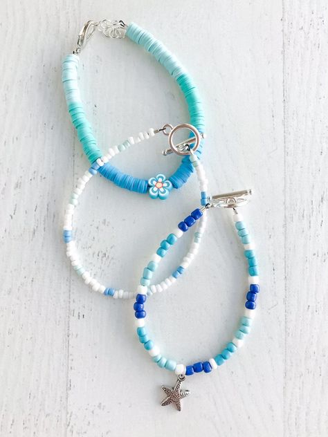 These bracelets come as a set of 3 beachy theme bracelets perfect for a beach day! Made to fit an average adult wrist. Please message me directly for a sizing adjustment (ex. smaller or larger than average) Coastal Bracelet Ideas, Beachy Crochet Ideas, Beachy Bracelet Ideas, Beachy Clay Bead Bracelet, Obx Bracelets Ideas, Beach Bracelets Diy, Bracelet Themes, Beach Accessories Jewelry, Beach Themed Bracelet