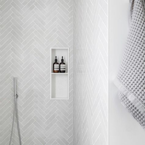 30 Amazing Herringbone Tile Bathroom Ideas To Sprinkle Personality Herringbone Tile Floor Small Bathroom, Light Gray Herringbone Tile Floor, Bathroom Herringbone Tile Floor Master Bath, Bathroom White Herringbone Tile, Large Subway Tile Shower White Herringbone, Herringbone Tile In Bathroom, Herringbone Tile Wall Bathroom, Herringbone Shower Tiles, Shower With Herringbone Tile