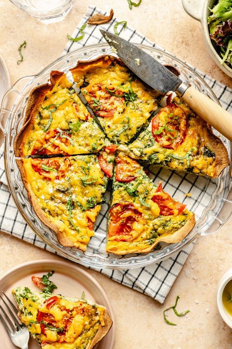 Did you know you could make a quiche with a tortilla crust? YES! This delicious tomato basil tortilla quiche is fun, easy to make, and packed with protein thanks to the eggs and cottage cheese. Customize with your favorite mix-ins for the perfect meal prep breakfast during busy weeks! Eggs And Cottage Cheese, Ambitious Kitchen Recipes, Sweet Potato Crust Quiche, Tortilla Quiche, Bakery Style Blueberry Muffins, Low Carb Quiche, Breakfast Quiche Recipes, Prep Breakfast, Ambitious Kitchen