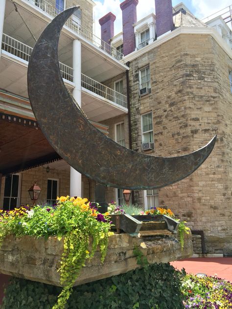 The Crescent Hotel and the magnificent crescent moon statue in the front. #eurekasprings #crescenthotel Crescent Hotel Eureka Springs, Crescent Hotel, Eureka Springs, Haunted Places, Crescent Moon, Crescent, Springs, Moon, Statue