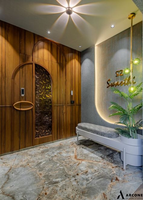 "Swasthi" - A Contemporary And Luxurious House For A Modern Indian Family | Arcone design studio - The Architects Diary Indian Home Main Door Design, Luxury Main Door Design Entrance, Vestibule Design Modern, Home Entry Design Entrance, Flat Entry Design, Entry Foyer Design Ideas, Luxury Safety Door Design, Flat Entrance Design Modern Luxury, House Entry Door Designs