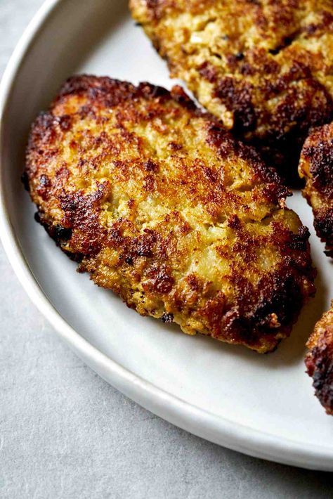 Kotlet are a Persian version of meat and potato patties, usually served with rice or pita bread. This recipe from my grandmother is packed with flavors from cumin and onion - delicious served hot or cold! #persianfood #kotlet #persian Fried Peppers, Persian Rice, Meatball Recipes Easy, Potato Patties, Pizza Sandwich, Pizza Burgers, Leftover Mashed Potatoes, Persian Food, Pita Bread