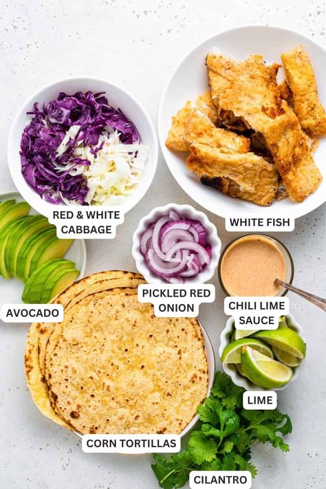 Crispy fish tacos are a delicious 30-minute dinner! Serve them in warm tortillas and pile on the toppings for a healthy, protein-packed meal! Greek Fish Tacos, Frozen Fish Tacos, Tilapia Fish Tacos Recipes, Fried Fish Taco, Swordfish Tacos, Tuna Tacos Recipe, Fish Tacos Recipes, Fish Burrito, Crispy Fish Tacos