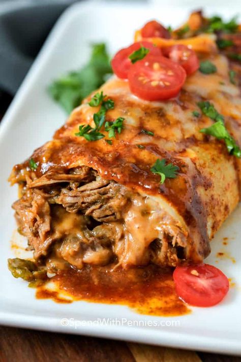 Crockpot beef burritos are a simple meal to set and forget. Just make the shredded beef but slow cooking it all day, then wrap inside a tortilla with refried bean and other Mexican toppings. Top with cheese and bake to create an irresistibly cheesy authentic beef bean burrito! #spendwithpennies #slowcookerbeefburritos #slowcooker #crockpot #beefrecipe #Mexican #maindish Shredded Beef Ideas, Baked Burritos Beef, Shredded Beef Burrito Recipes, Bean And Beef Burritos, Shredded Beef Burritos, Mexican Toppings, Slow Cooker Burrito, Beef And Bean Burritos, Beef Burrito Recipe