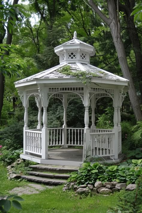 Step into a whimsical wonderland with these garden gazebo picnic ideas, featuring enchanting decor, delicious treats, and charming ambiance for a magical outdoor celebration. Small Garden Gazebo, Gazebo Picnic, Enclosed Gazebo, White Gazebo, Gazebo With Fire Pit, Wonderland Garden, Gazebo Ideas, Outdoor Celebration, Wooden Gazebo