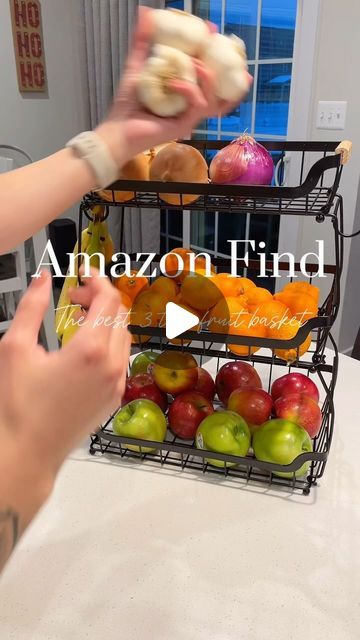 Shay | TouShaýFinds 🔎 🛍️ on Instagram: "✨Comment “basket” for direct link! ✨   Elevate your kitchen game with the GILLAS 3 Tier Countertop Fruit Stand! 🍎🍌🍊   Keep your fruits fresh, organized, and within reach. Say goodbye to cluttered countertops and hello to stylish storage!   Perfect for any kitchen aesthetic, this sleek stand adds a touch of elegance while maximizing space. 🌟   Get yours now and transform your kitchen into a fruit haven!   #commissionablelink #affiliatelink #ad" Storing Fruit On Counter Ideas, Organize Fruit On Counter, How To Store Fruit On Counter, Kitchen Island Fruit Display, Fruit Vegetables Storage, Counter Top Fruit Storage Ideas, Kitchen Veggie Basket, Fruit On Counter, Counter Fruit Storage