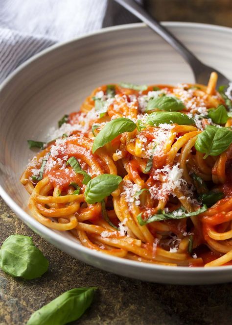 For an authentic Italian dinner, try my pasta al pomodoro! Spaghetti is tossed with a simple and delicious San Marzano tomato sauce and topped with basil and Parmesan in this easy recipe. | justalittlebitofbacon.com #italianrecipes #pastarecipes #easydinner #italian #spaghetti #pasta #tomatosauce Essen, Italian Sausage Pasta Bake, Italian Pasta Recipes Authentic, Authentic Italian Pasta, Italian Pasta Recipe, Chipotle Pasta, Tomato Sauces, Pomodoro Sauce, Pasta Al Pomodoro