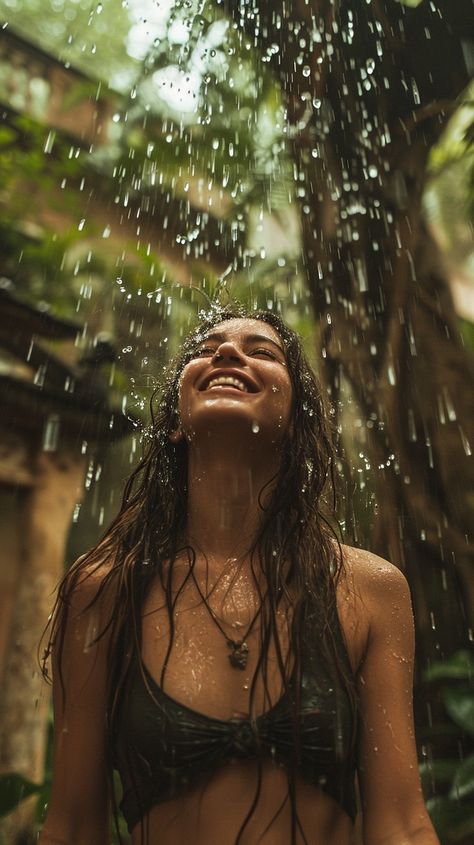 In the midst of a serene natural backdrop, a woman is immersed in a moment of pure bliss as the rain showers down upon her. The water droplets are illuminated against the verdant environment, drawing attention to the woman's joyful expression. This scene captures the essence of finding happiness in simple pleasures, surrounded by the beauty of nature. Woman Shower Aesthetic, Smile Asthetic Picture, Pure Joy Aesthetic, Pure Happiness Aesthetic, Living Your Best Life Aesthetic, Wellness Aesthetic Black Woman, Blissful Aesthetic, Happy Person Aesthetic, Happy Woman Aesthetic