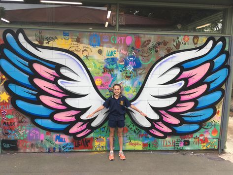 Mont Albert Primary School Mural | Blender Creatives | Creative Art ... Wing Mural, Angel Wings Art, Wall Street Art, School Wall Art, School Murals, School Painting, Zumba Dance, Wall Painting Decor, Wings Art