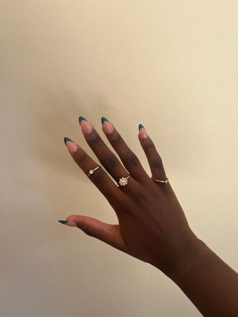 black girl hands and green French tips, almond shaped with golden rings Emerald Green French Tip Nails Almond, Dark Green Nails Almond, Dark Green French Nails, Emerald Nails Acrylic, Colour French Tips Nails, Dark Green French Tip, Dark Green French Tip Nails, Green French Tip Nails, Nail Inspiration Winter