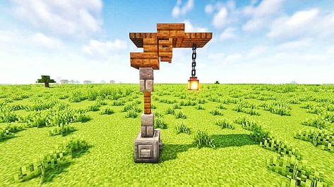 A wood and stone lamppost design using a Lantern as the light source. Minecraft Lamp Post Design Minecraft Lamp Post Ideas Cute, Lamp Post Minecraft Designs, Minecraft Lamp Post Designs, Mc Lamp Post, Minecraft Hanging Lantern, Lamp Post Design Minecraft, Mincraft Lamppost, Light Post Minecraft Ideas, Lantern Post Minecraft