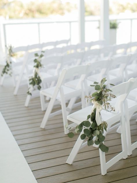 Eucalyptus Wedding Aisle Chair Decor, Eucalyptus Beach Wedding, Pier Wedding Decorations, Simple Beach Ceremony Decor, Wedding Isles Ideas, Ceremony Chair Decorations, Aisle Florals, Wedding Ceremony Chairs, Wedding Isles