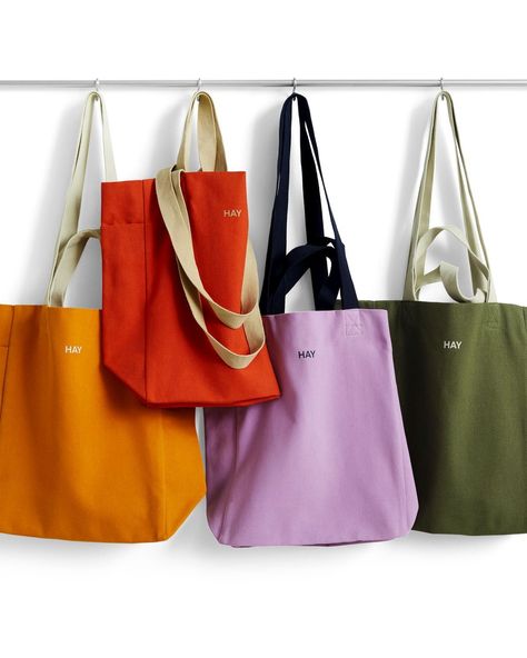 The Everyday Tote by HAY is a colourful and multifunctional bag that can be used for carrying everything from groceries and sports gear to laptops and books. Made of thick and durable organic cotton, it features two sets of handles that enable it to be held in the hand or carried over the shoulder. Order now from Designkiosk.eu #haydesign #designlovers #togo #totebag #happyliving #giftidea #dk_designkiosk Burlap Tote Bags, Burlap Tote, Hay Design, Everyday Tote Bag, Everyday Tote, The Hand, Sports Gear, Carry On, Organic Cotton