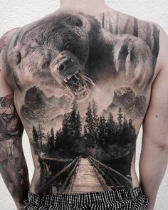 Full back piece with a wooden bridge over a picturesque lake and a large angry bear above. Tattoo by Stefan, an artist based in Zwickau, Germany. Cool Back Tattoos, Bear Tattoo Designs, Hunting Tattoos, Tattoo Placements, Back Piece Tattoo, Bear Tattoos, Full Back Tattoos, Forest Tattoos, Pieces Tattoo