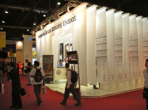 outside of the book fair stand for the US Embassy Book Exposition Stand, Futuristic Event, Exposition Design, Book Exhibition, Creative Booths, Book Expo, Fair Stand, Exhibition Stall Design, Stall Design