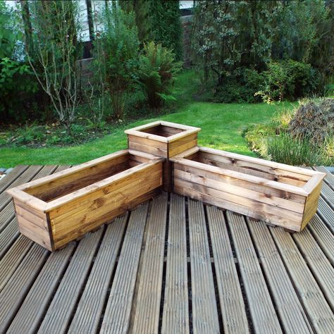 This corner planter set is a unique addition to any garden. Featuring two troughs and a square planter. Made in Britain, and fashioned from FSC Timber and Scandinavian Redwood, this set is incredibly durable. Featuring a slatted base for drainage. Components can be used separately. Corner Planter, Planter Trough, Decking Patio, Deck Remodel, Uk Summer, Wooden Planter Boxes, Trough Planters, Wooden Planter, Square Planters