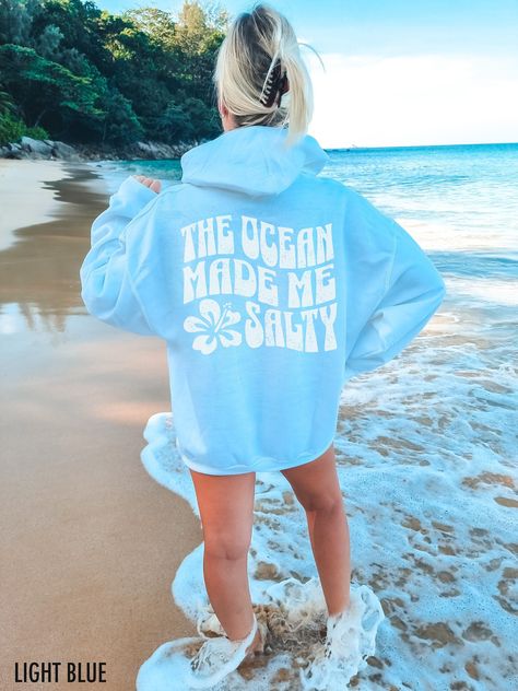 Dive into coastal vibes with our "The Ocean Made Me Salty" hoodie. This fabulous graphic will be printed on a Gildan 18500 Unisex Hoodie which runs true to size. If you are looking for an oversized fit, we recommend sizing up. Please refer to the size charts in the images. We use professional quality DGT printing on all our apparel. Direct-to-garment, or DTG, is a high quality printing method that sprays ink directly onto the garment so there is no peeling or cracking. Production Time: 1-5 days Beach Hoodie, Cute Hoodies Aesthetic, Outfit Outer, Graphic Hoodies Aesthetic, Womens Oversized Hoodie, Hoodies Aesthetic, Preppy Sweater, Beach Sweatshirt, Hoodie Aesthetic