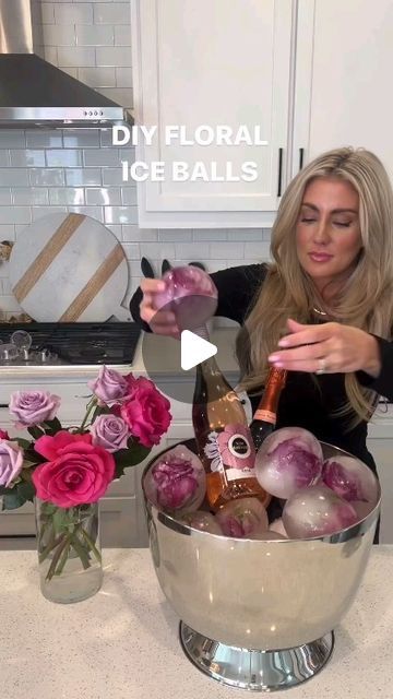 Desinger on Instagram: "💐DIY FLORAL ICE BALL instructions: (The perfect Galentine’s party touch) 🛍️ comment “links” to get the ice bucket & balloons I used sent to your DM’s! . 1. Cut the stems off your roses, leaving only the flower heads. 2. Stretch open a balloon and insert a rose head into it. 3. Fill the balloon with water until it is your desired size. Make sure the rose head is fully covered in the water. 4. Tie your balloon tightly to so that no water escapes. 5. Place the balloons in your freezer and freeze it for several hours or overnight until the water is completely frozen. 6. Once the ice spheres are frozen, remove the balloon by cutting it off with scissors or by running the frozen balloon under warm water for a few seconds until it peels away from the ice. 7. Arrang Flower Ice Cubes Diy, Floral Ice Balls, Frozen Water Balloons, Diy Ice Bucket, Floral Ice Bucket, Floral Ice Cubes, Frozen Balloons, Flower Ice Cubes, Frozen Rose