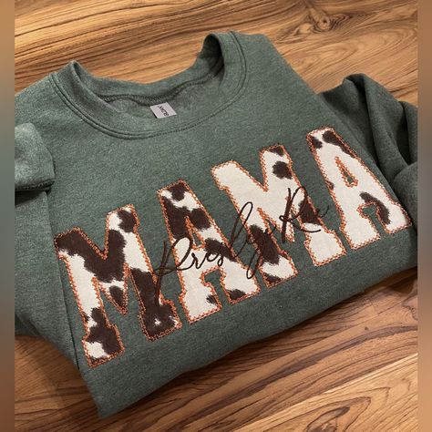 New In Bag “Mama” Cowprint Sweatshirt. Photos Of The Sweatshirt With Name Are Stock Photos From The Store So You Can See What It Looks Like. The Only Thing On This Sweatshirt Is “Mama” Fall Mom Sweatshirt, Mom Embroidered Sweatshirt, Applique Sweatshirts, Embroidery Designs Sweatshirt, Patch Sweatshirt Diy, Trending Sweatshirts, Trending Embroidery, Sew Shirt, Handmade Tops