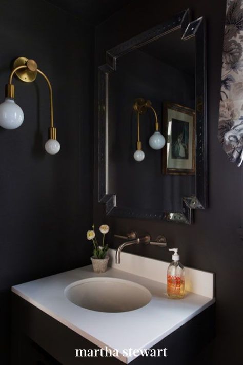 Don't be afraid to take a design risk—like painting every wall, ceiling and all, black—in a small half-bathroom. Mary Patton did just that in this "jewel box" of a space and completed the look with a modern exposed-bulb fixture. #bathroomideas #marthastewart #homereno #bathroomdecor Half Bathroom Design Ideas, Half Bathroom Design, Powder Room Paint, Small Half Bathroom, Dark Bathroom Ideas, Dark Bathrooms, Dark Walls, Room Paint Colors, Half Bathroom